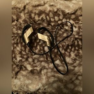 Shiny gold bluetooth earbuds